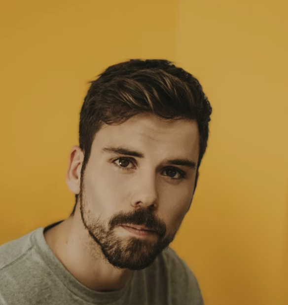 Bearded man yellow background portrait